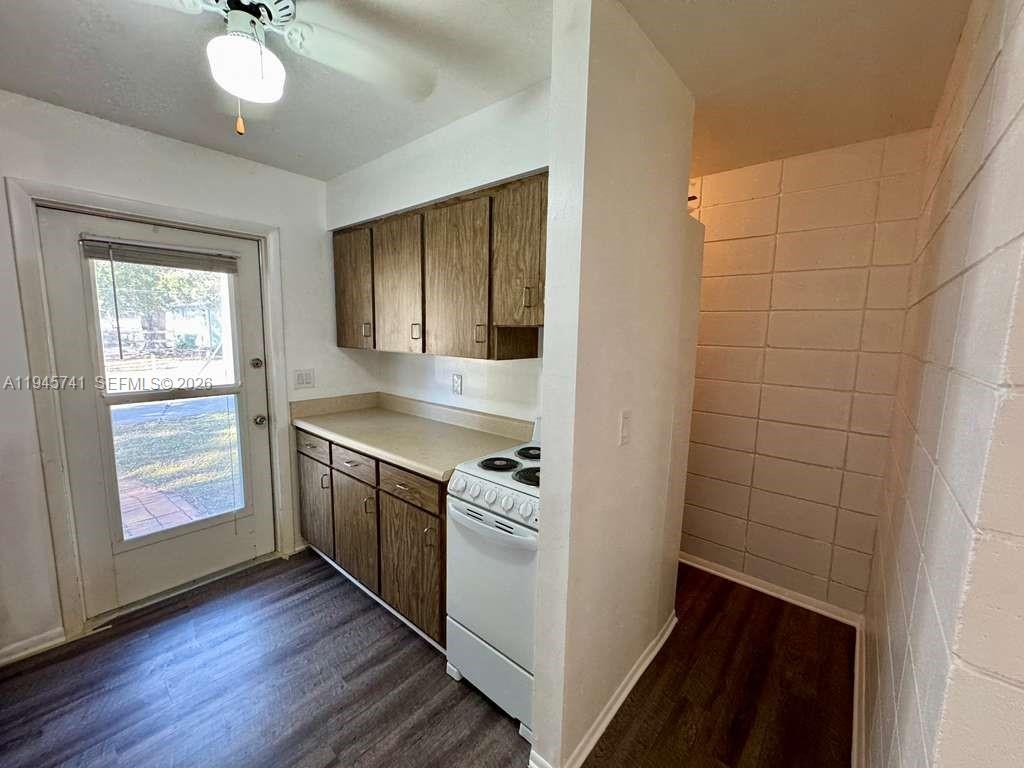 5100 Rilma Avenue Sarasota, FL 34234 - Photo 6 of 18 a kitchen with a refrigerator and a stove