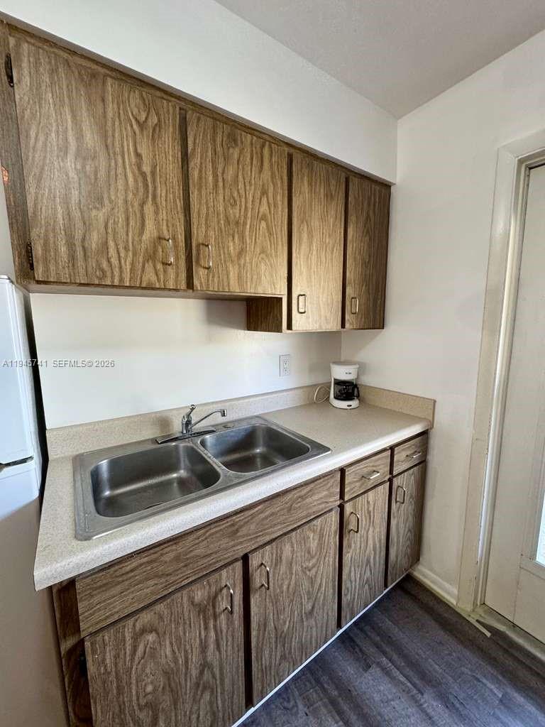 5100 Rilma Avenue Sarasota, FL 34234 - Photo 8 of 18 a kitchen with a sink and cabinets
