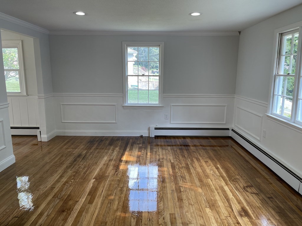 73 Lancaster Road Clinton, MA 01510 - Photo 8 of 34 a view of a room with wooden floor and outdoor space