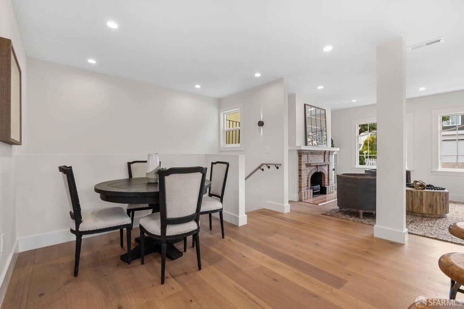 348 Edna Street San Francisco, CA 94112 - Photo 12 of 45 a view of a dining room with furniture and a fireplace
