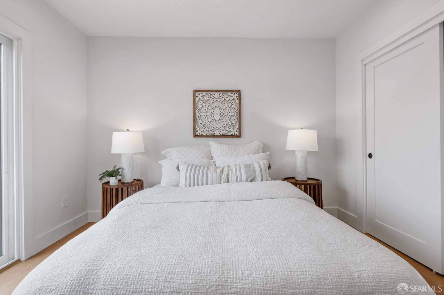 348 Edna Street San Francisco, CA 94112 - Photo 15 of 45 a bedroom with a bed and a lamp