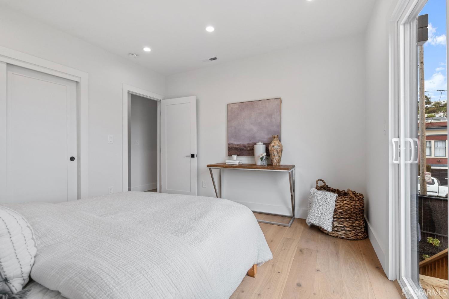 348 Edna Street San Francisco, CA 94112 - Photo 16 of 45 a bedroom with a bed and a large mirror