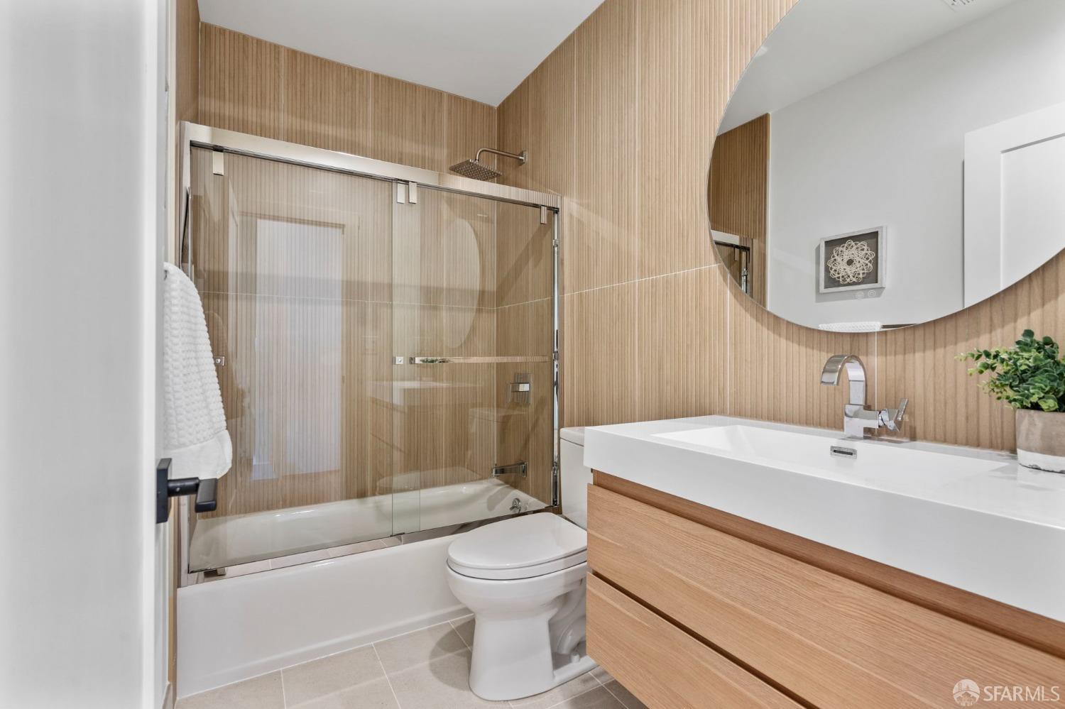 348 Edna Street San Francisco, CA 94112 - Photo 17 of 45 a bathroom with a sink a toilet and shower