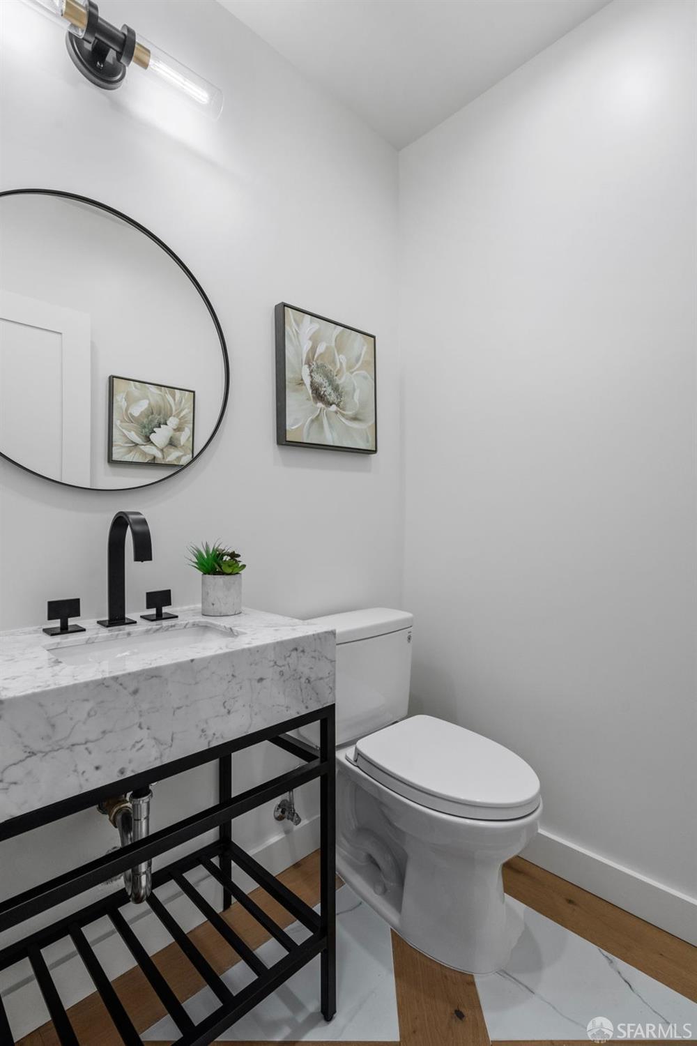 348 Edna Street San Francisco, CA 94112 - Photo 20 of 45 a bathroom with a granite countertop toilet a sink and mirror