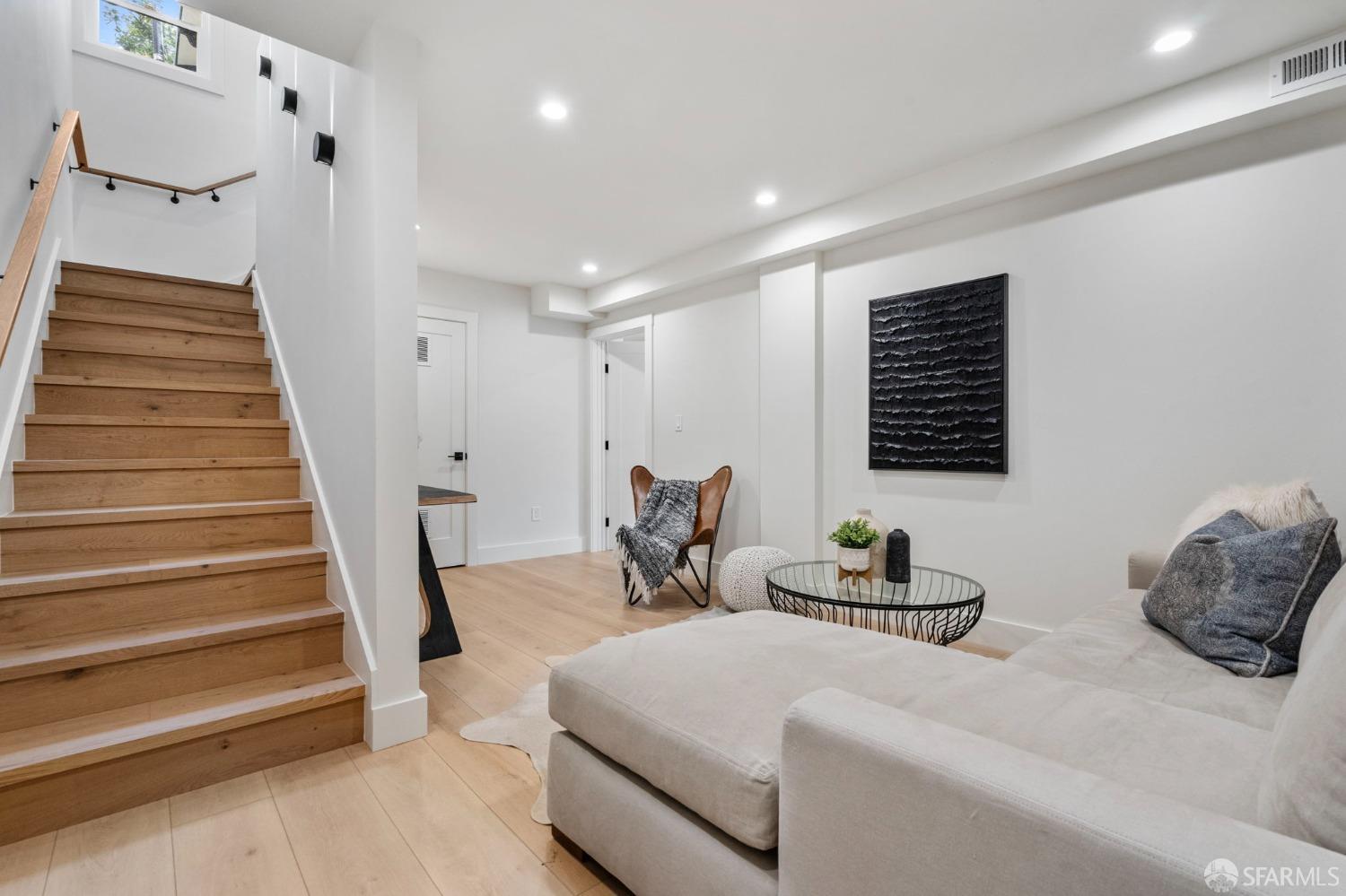 348 Edna Street San Francisco, CA 94112 - Photo 21 of 45 a bedroom with furniture and a wooden floor