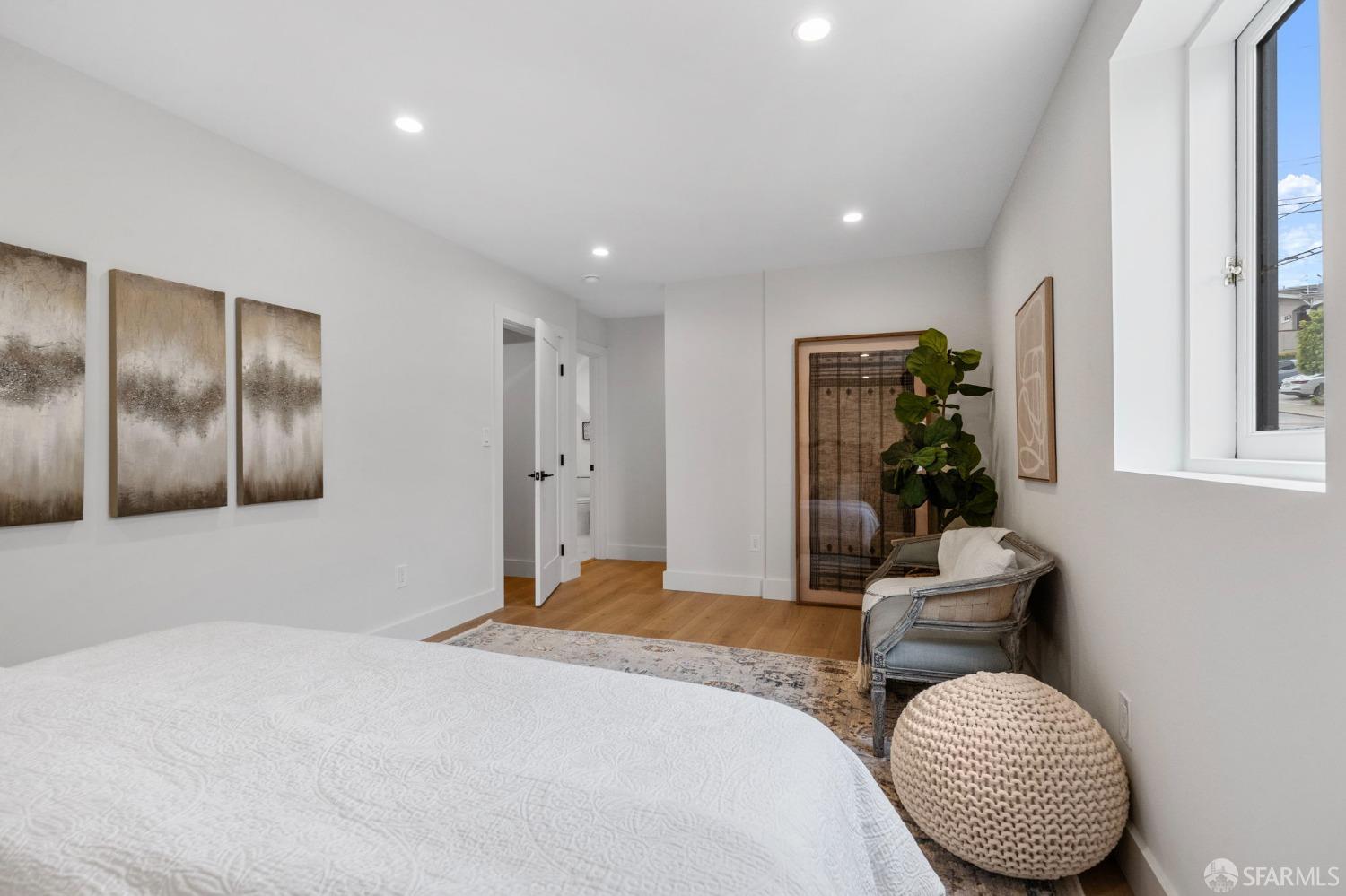 348 Edna Street San Francisco, CA 94112 - Photo 26 of 45 a bedroom with a bed and a chair