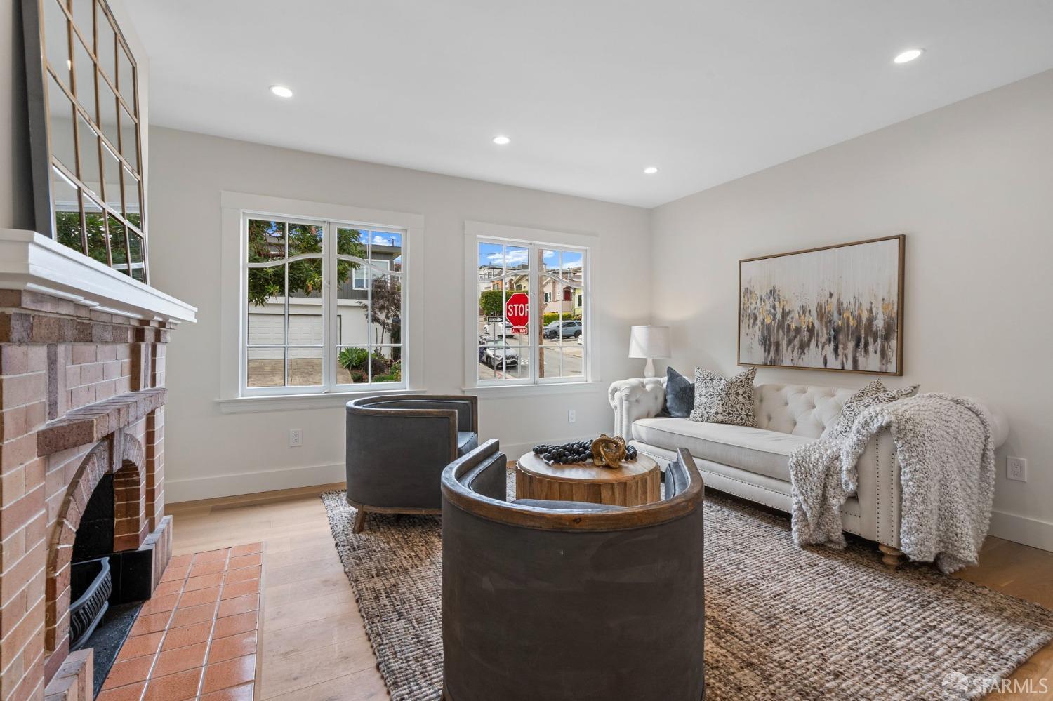348 Edna Street San Francisco, CA 94112 - Photo 4 of 45 a living room with furniture and a fireplace