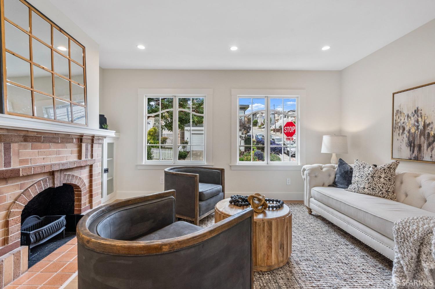 348 Edna Street San Francisco, CA 94112 - Photo 5 of 45 a living room with furniture fireplace and window