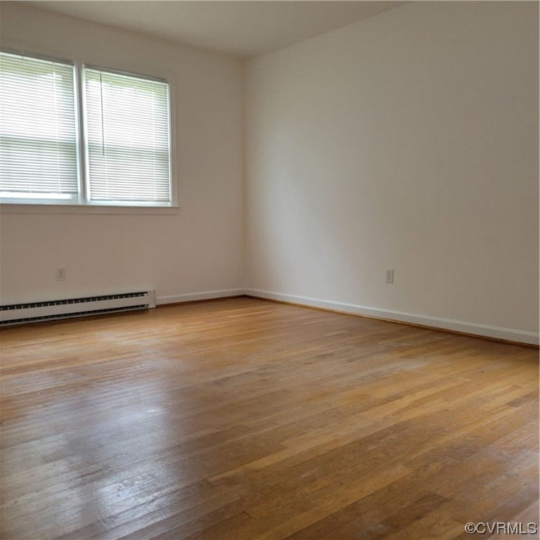 12500 Easy Street Chester, VA 23831 - Photo 2 of 5 an empty room with wooden floor and windows