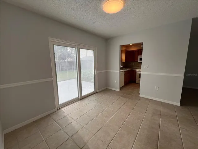 a view of a kitchen with a sink dishwasher and a refrigerator