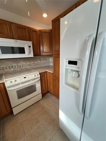 a kitchen with stainless steel appliances white cabinets and a stove