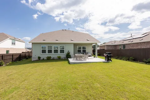 a view of a house with swimming pool and sitting area