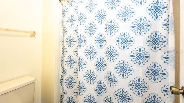 a bathroom with a shower curtain