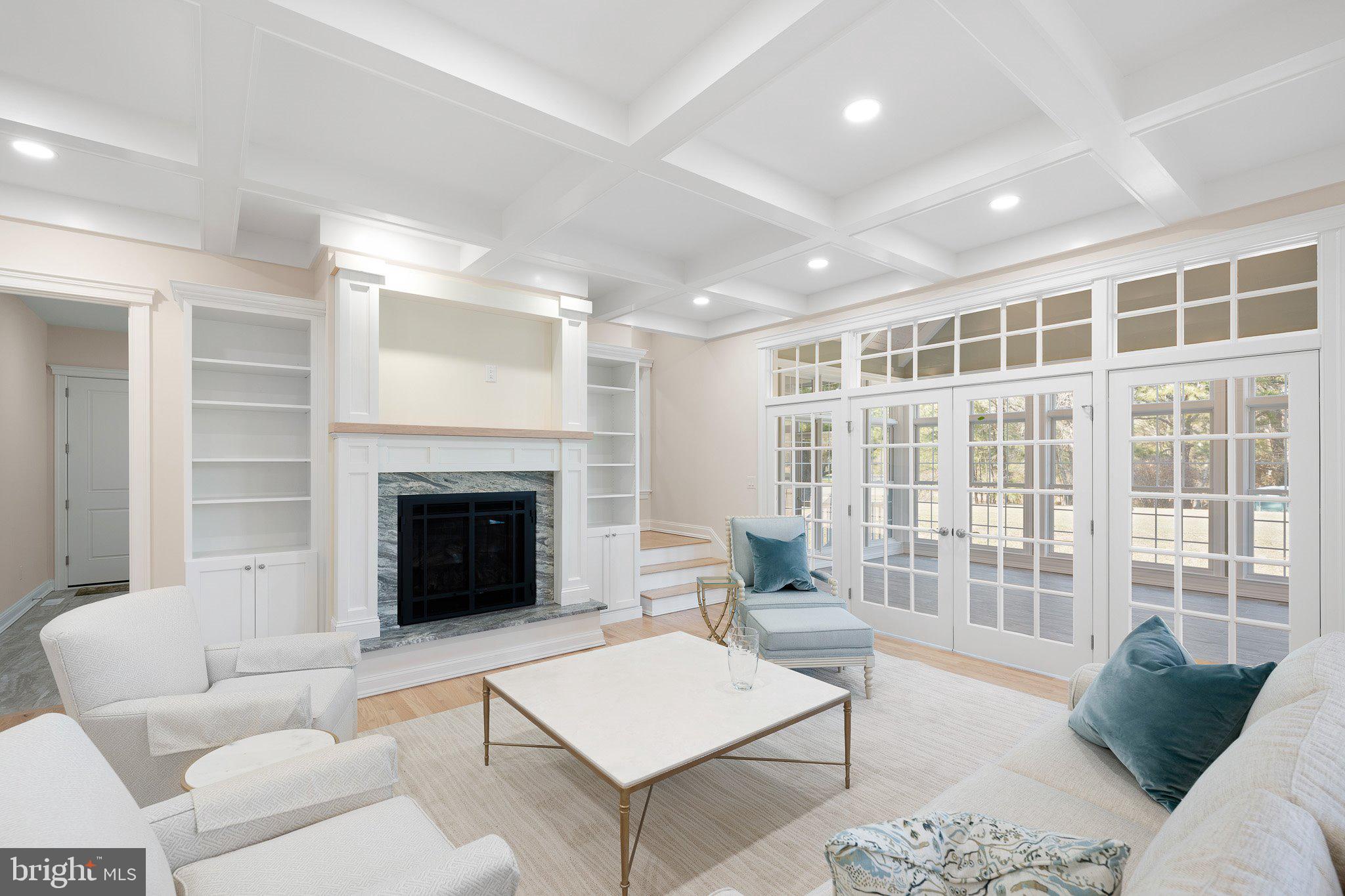 403 Canal Way East Bethany Beach, DE 19930 - Photo 20 of 51 a living room with furniture and a fireplace