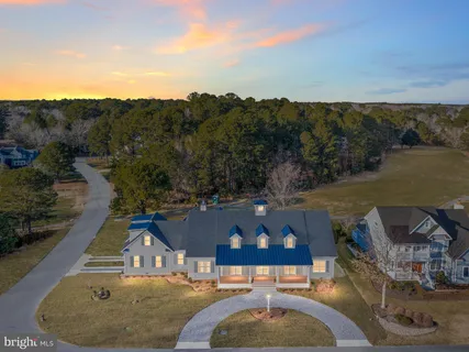 an aerial view of a house with outdoor space