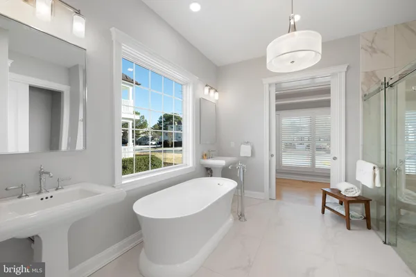 a spacious bathroom with a granite countertop sink a toilet and shower