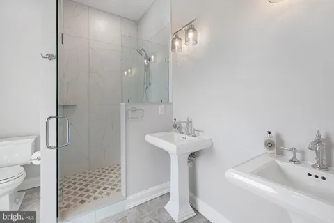 a view of livingroom with washer and dryer