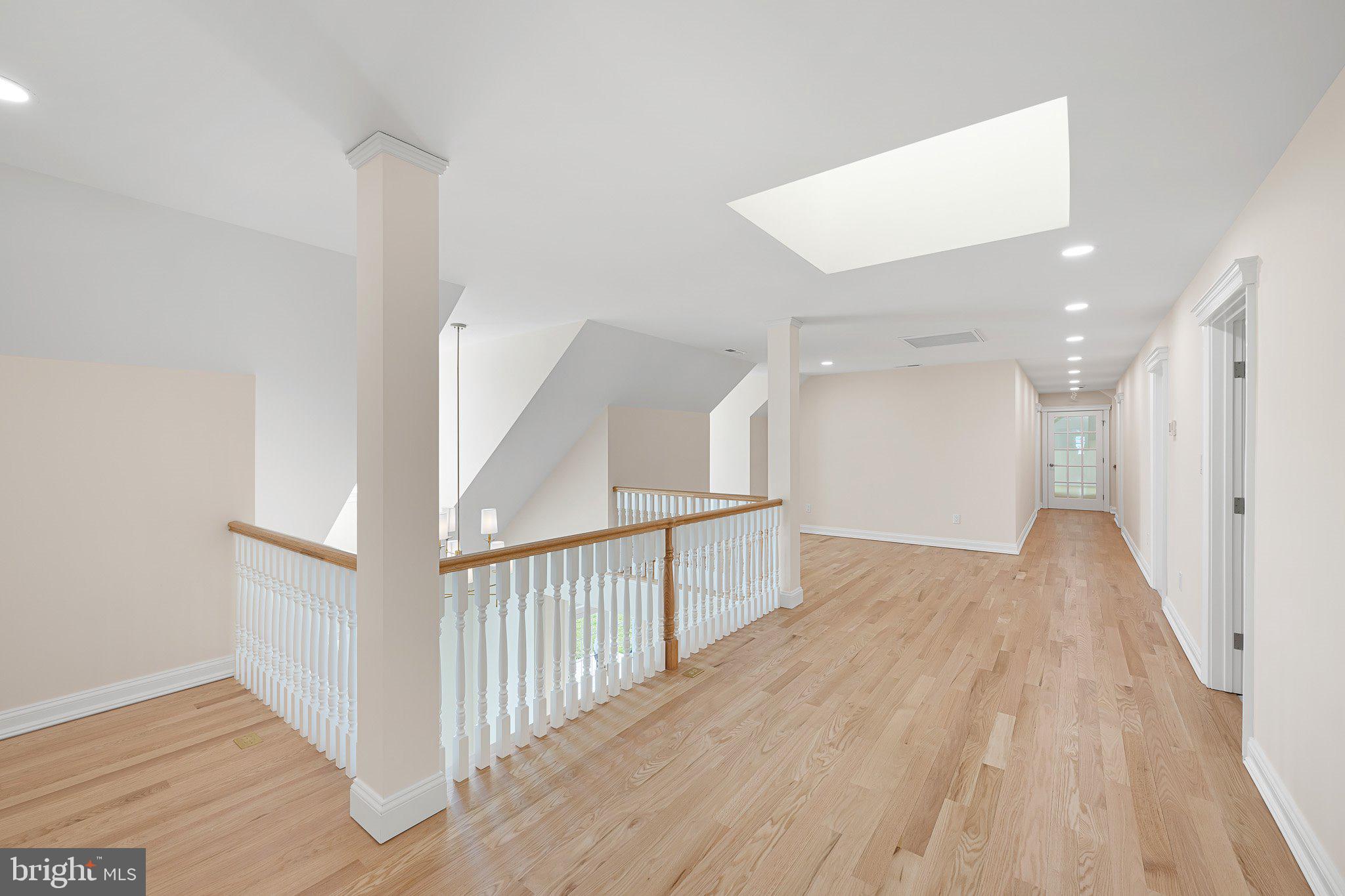 403 Canal Way East Bethany Beach, DE 19930 - Photo 34 of 51 a view of a hallway with wooden floor