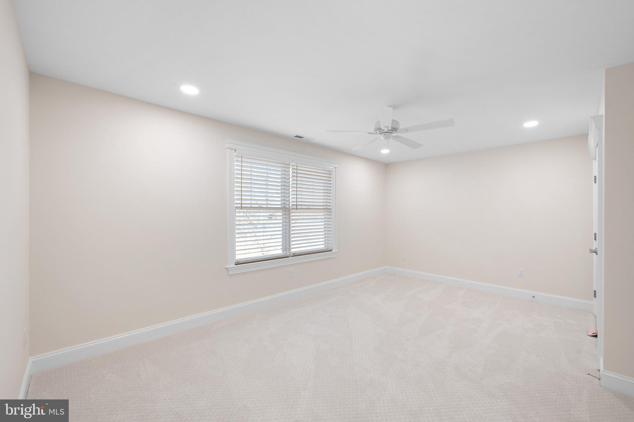 403 Canal Way East Bethany Beach, DE 19930 - Photo 36 of 51 an empty room with windows and closet