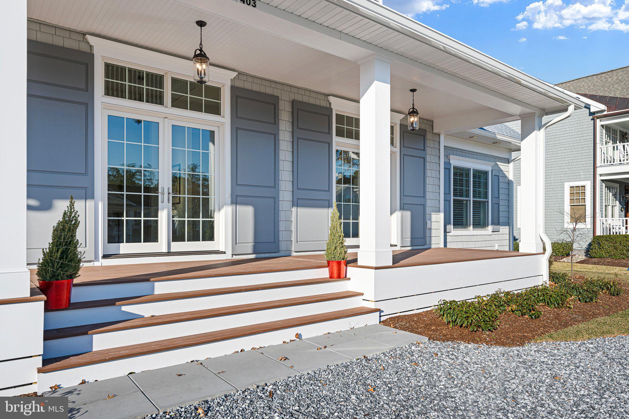 403 Canal Way East Bethany Beach, DE 19930 - Photo 6 of 51 a front view of a house with a yard