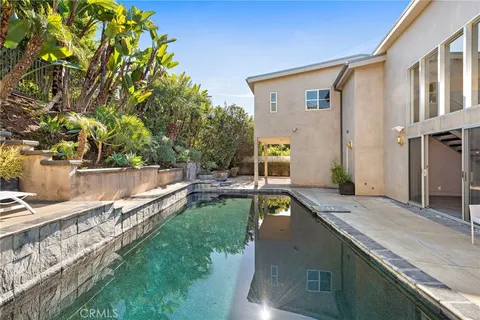 a view of a house with swimming pool