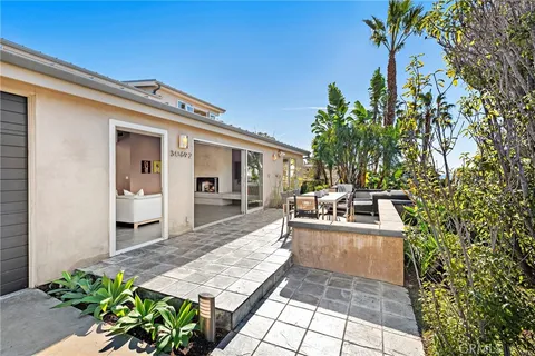 a view of a living room and outdoor kitchen