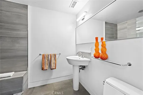 a bathroom with a sink toilet and vanity