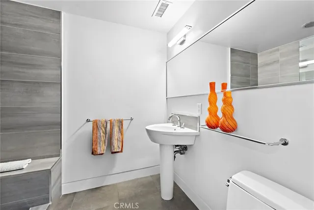 a bathroom with a sink toilet and vanity