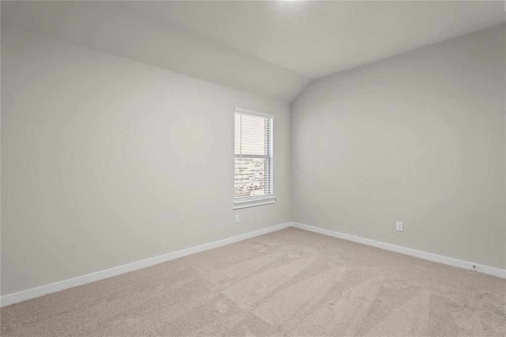 507 Avocet Road Princeton, TX 75407 - Photo 17 of 31 Neutral-toned carpeting, light wall paint, and a window with blinds
