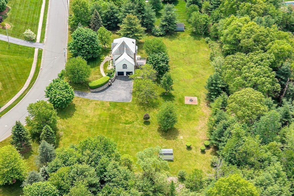 83 Jefferson Road Franklin, MA 02038 - Photo 29 of 34 an aerial view of residential houses with outdoor space and trees all around
