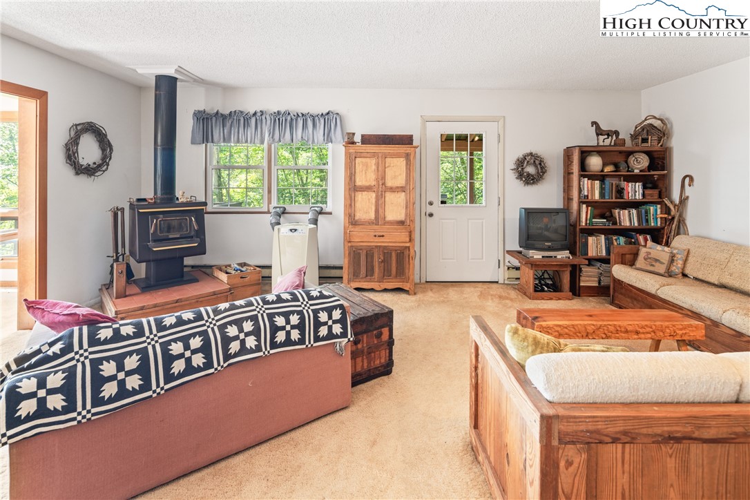 2811 Georges Gap Road Vilas, NC 28692 - Photo 12 of 50 a living room with furniture and a window