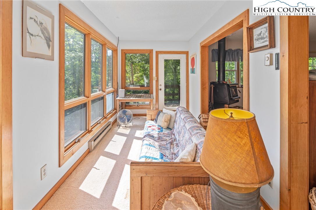 2811 Georges Gap Road Vilas, NC 28692 - Photo 15 of 50 a living room with furniture and a large window