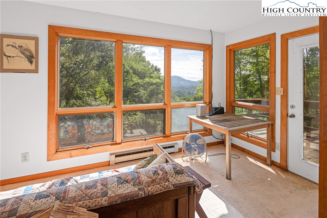2811 Georges Gap Road Vilas, NC 28692 - Photo 16 of 50 a living room filled with furniture and a window
