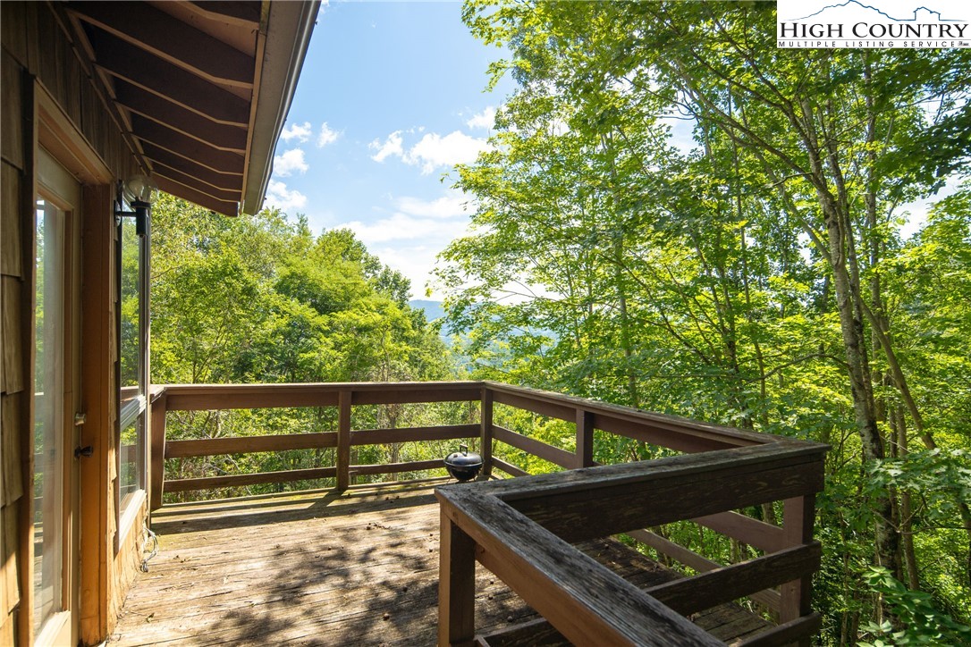 2811 Georges Gap Road Vilas, NC 28692 - Photo 28 of 39 a view of outdoor space with deck and tree