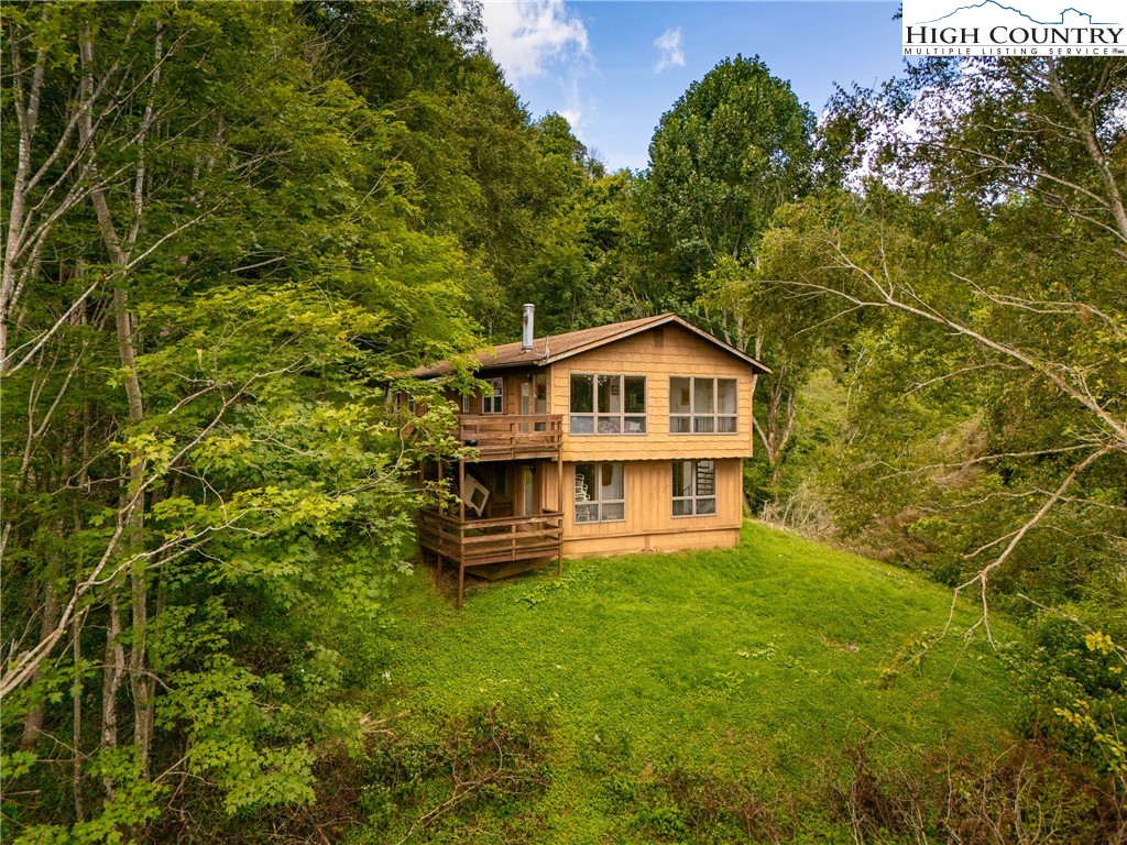 2811 Georges Gap Road Vilas, NC 28692 - Photo 42 of 50 a view of a house with a yard