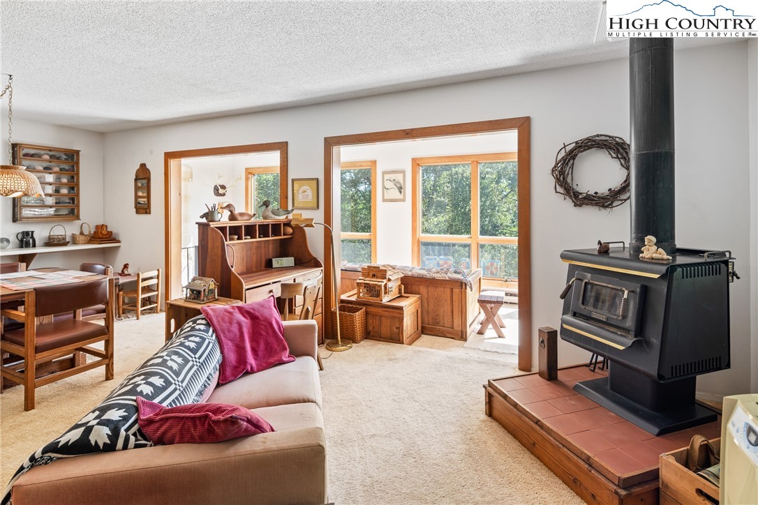 2811 Georges Gap Road Vilas, NC 28692 - Photo 6 of 39 a living room with furniture and a large window