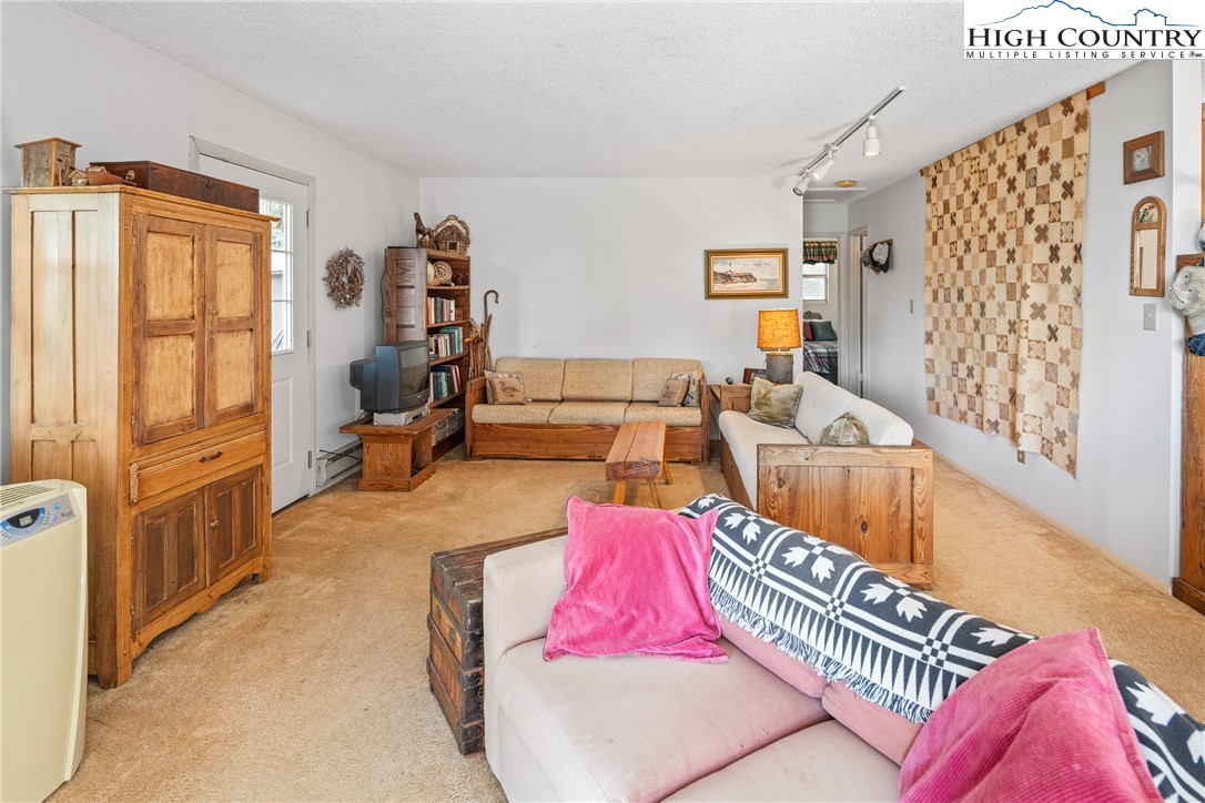 2811 Georges Gap Road Vilas, NC 28692 - Photo 8 of 50 a living room with furniture and wooden floor