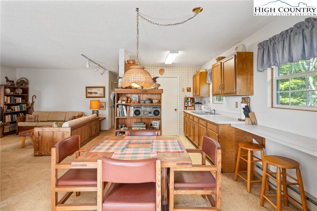 2811 Georges Gap Road Vilas, NC 28692 - Photo 10 of 50 a large kitchen with a table and chairs