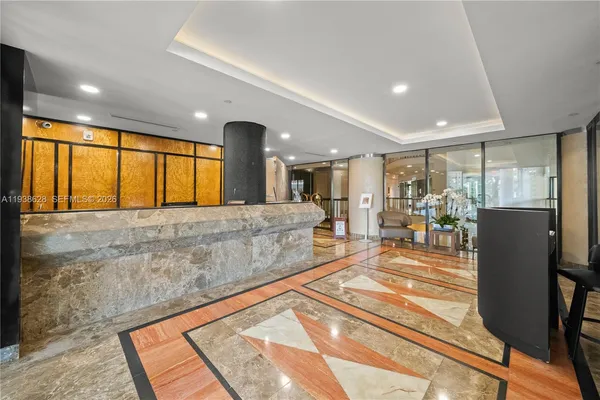 a view of a living room and a kitchen