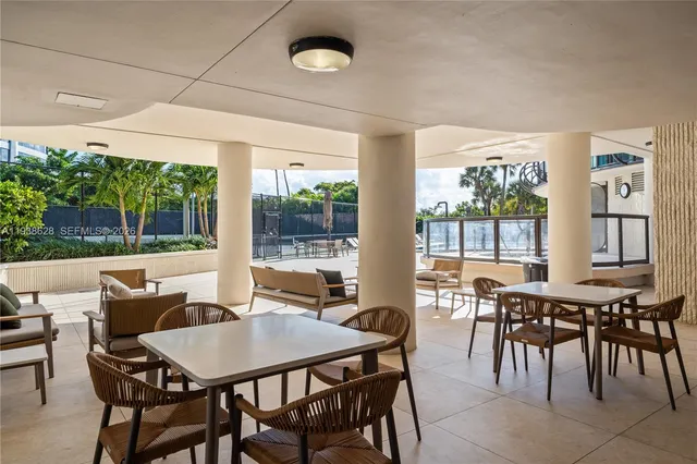a view of a swimming pool with a sitting area