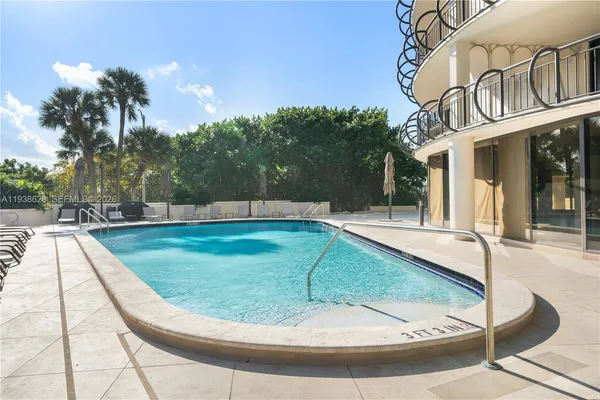 a view of a swimming pool with a sitting area