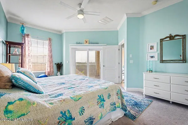 a bedroom with a bed dresser and a window