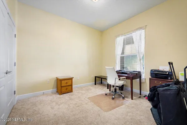 a view of a workspace with furniture
