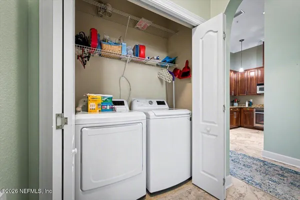 a utility room with dryer and washer
