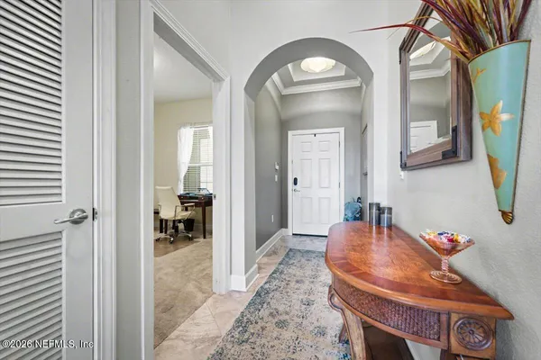 a view of a livingroom with furniture and a mirror