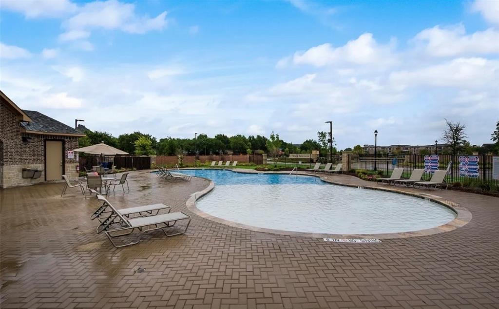 8010 Foraker Street Frisco, TX 75034 - Photo 17 of 17 a swimming pool with outdoor seating and barbeque oven