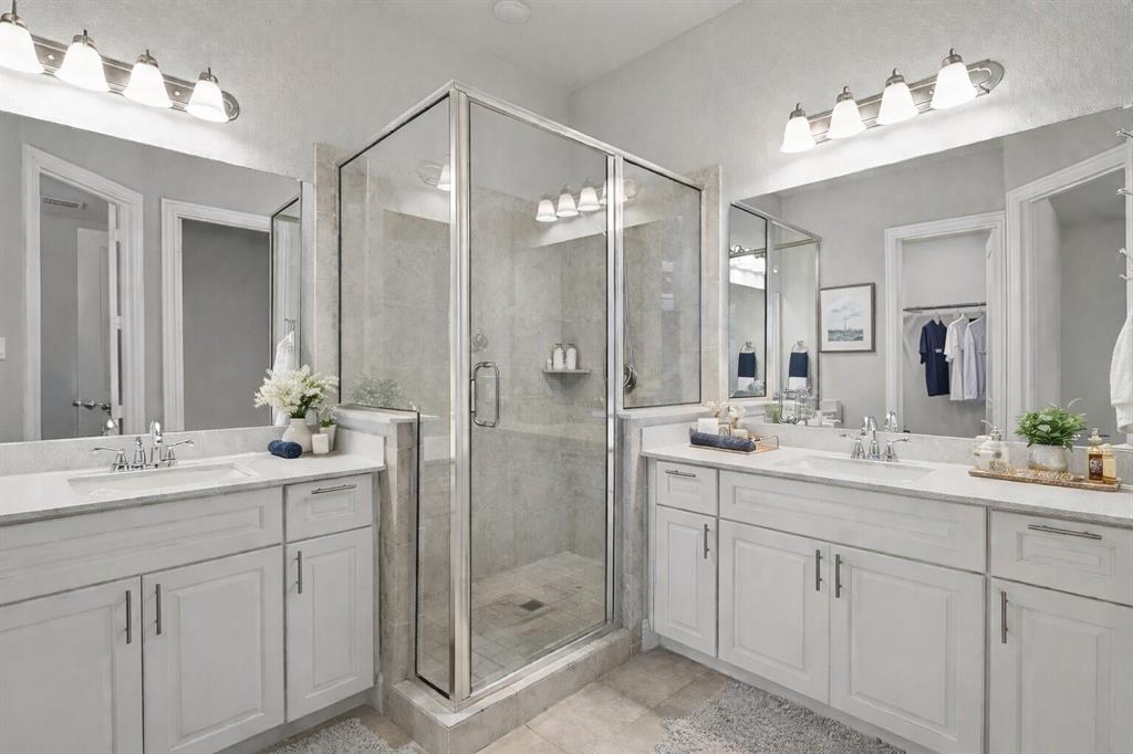 8010 Foraker Street Frisco, TX 75034 - Photo 10 of 17 a bathroom with a double vanity sink mirror and double
