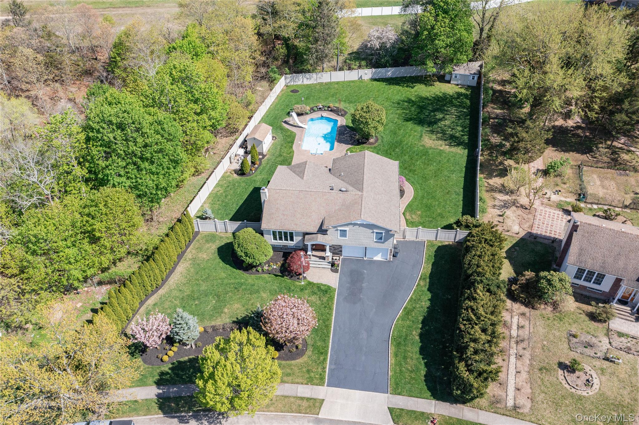 101 Hayrick Lane Commack, NY 11725 - Photo 1 of 50 an aerial view of a house with a garden