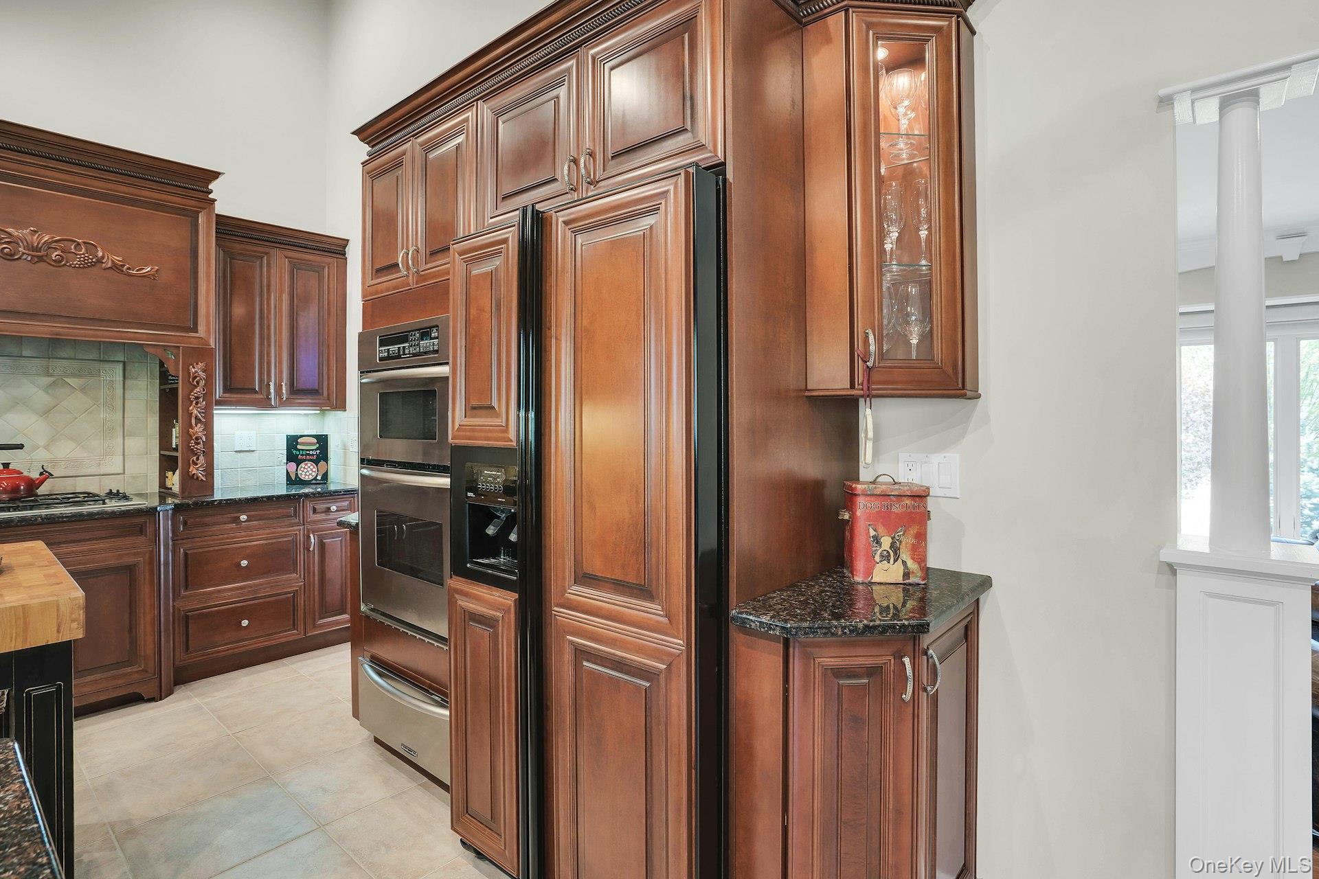 101 Hayrick Lane Commack, NY 11725 - Photo 14 of 50 a kitchen with stainless steel appliances granite countertop a refrigerator and cabinets