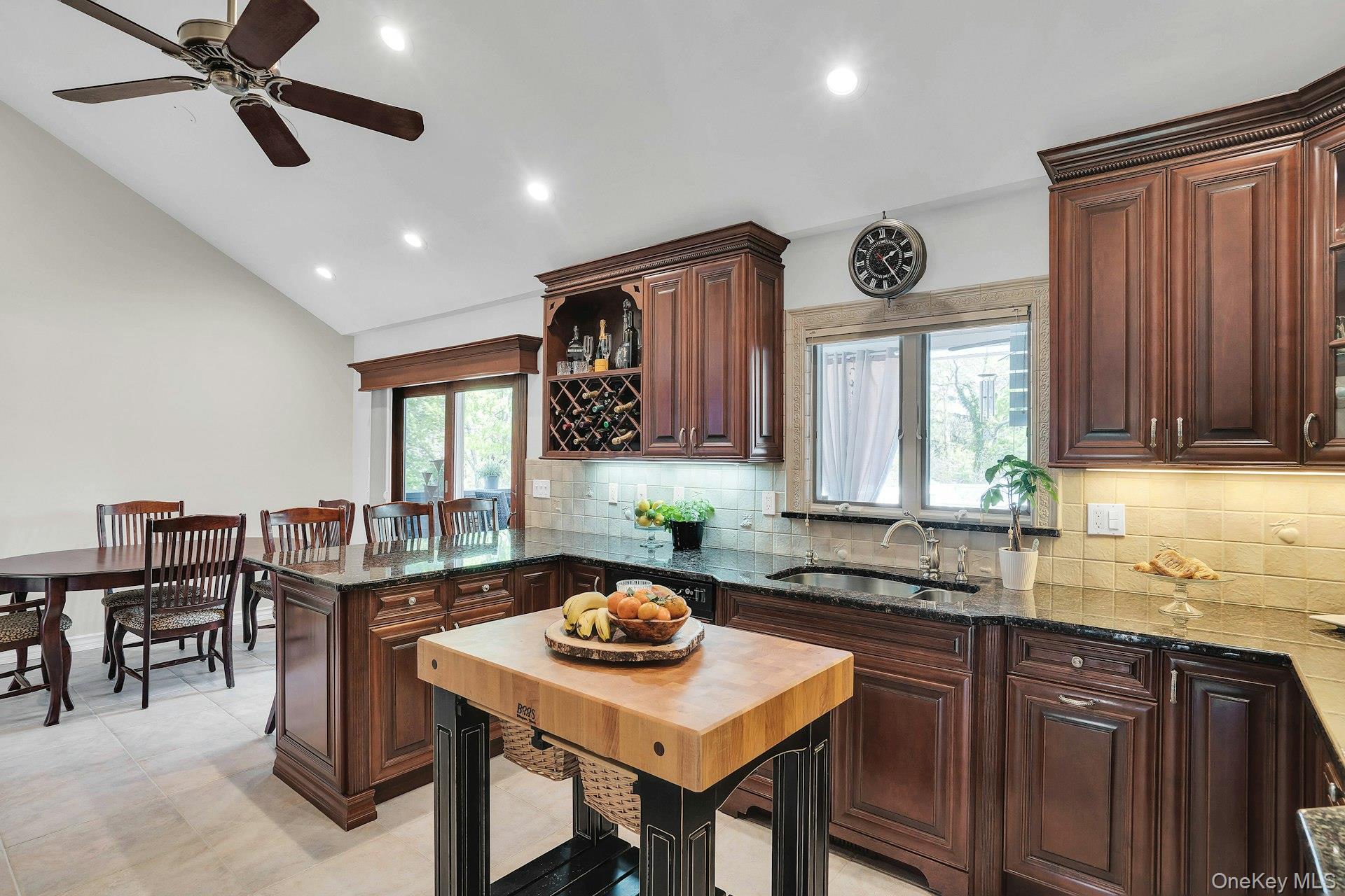 101 Hayrick Lane Commack, NY 11725 - Photo 16 of 50 a kitchen with a table and chairs in it